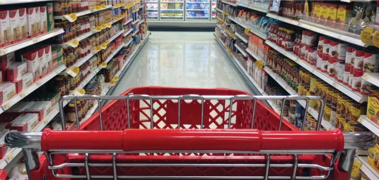 Red shopping card in a canned food aisle